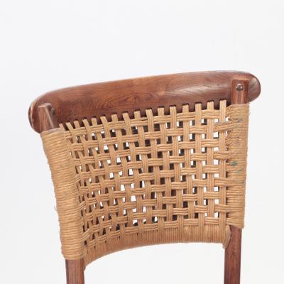 A pair of French Vintage oak side chairs with rattan backs and seats