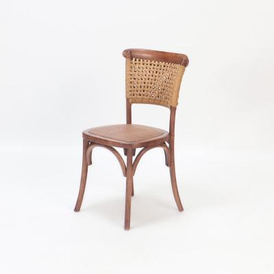 A pair of French Vintage oak side chairs with rattan backs and seats