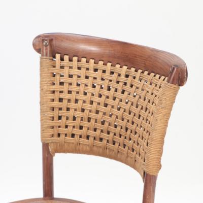 A pair of French Vintage oak side chairs with rattan backs and seats