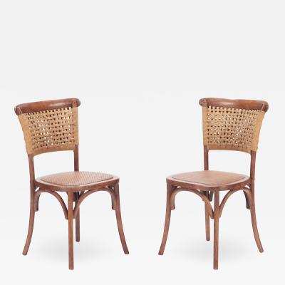 A pair of French Vintage oak side chairs with rattan backs and seats