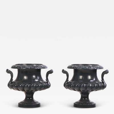 A pair of French cast iron garden urns C 1880 