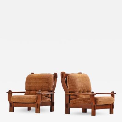 A pair of French or Belgian Brutalist style oak armchairs C 1950 