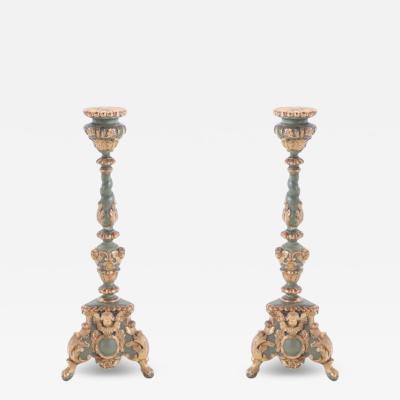 A pair of French painted and giltwood altar candlesticks C 1820 