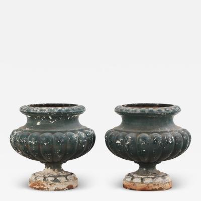 A pair of French table top cast iron planter urns C 1910 