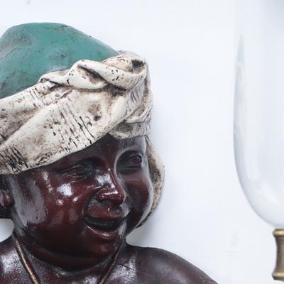 A pair of French vintage patinated brass figural wall sconces 19th C