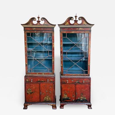 A pair of George III style scarlet chinoiserie decorated display cabinets