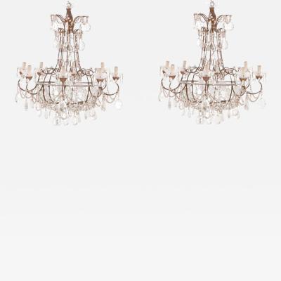 A pair of Italian iron and crystal eight arm chandeliers C 1950 