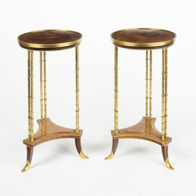 A pair of Louis XVI style mahogany and ormolu gueridons after Adam Weisweiler