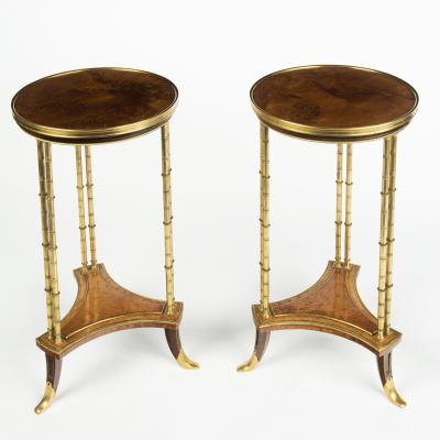 A pair of Louis XVI style mahogany and ormolu gueridons after Adam Weisweiler