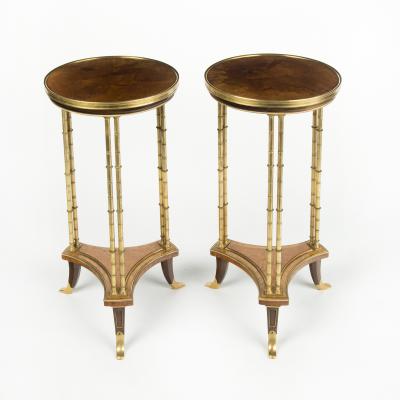 A pair of Louis XVI style mahogany and ormolu gueridons after Adam Weisweiler