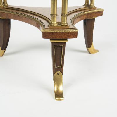 A pair of Louis XVI style mahogany and ormolu gueridons after Adam Weisweiler