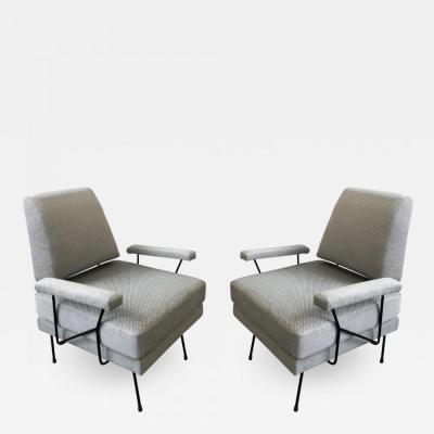 A pair of Mid Century Modern iron armchairs newly upholstered 