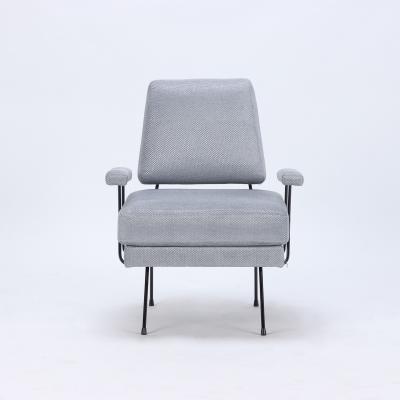 A pair of Mid Century Modern iron armchairs newly upholstered 