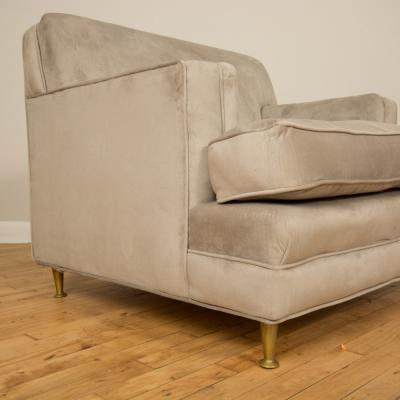 A pair of Mid Century oversized Italian club chairs with bronze legs C 1950