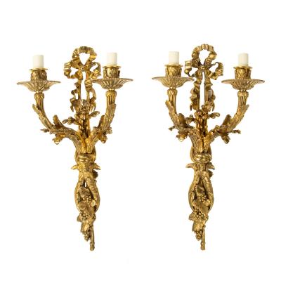 A pair of Napoleon III two branch ormolu wall lights