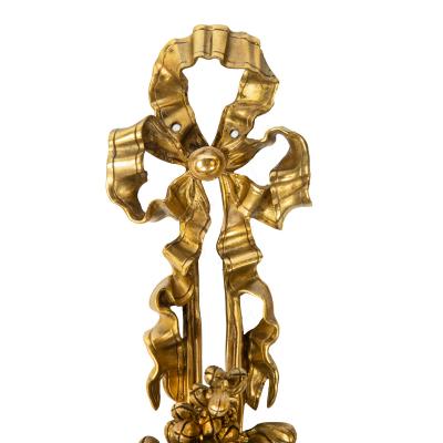 A pair of Napoleon III two branch ormolu wall lights