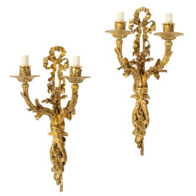 A pair of Napoleon III two branch ormolu wall lights