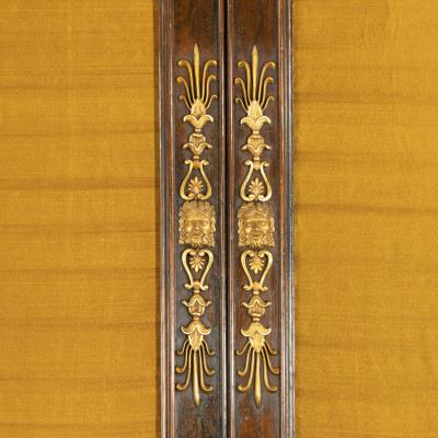 A pair of Regency brass inlaid rosewood side cabinets