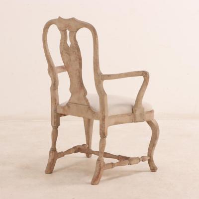 A pair of Swedish Rococo carved and whitewashed walnut armchairs 18th C 