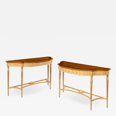 A pair of Victorian Hepplewhite style satinwood console tables