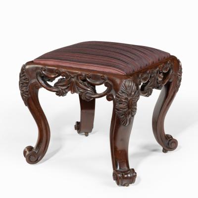 A pair of Victorian carved mahogany stools
