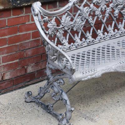 A pair of aluminum sleigh form garden benches circa 1950