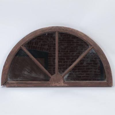 A pair of arched transome windows with later mirrors C 1900