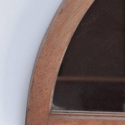A pair of arched transome windows with later mirrors C 1900