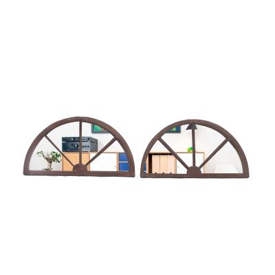 A pair of arched transome windows with later mirrors C 1900