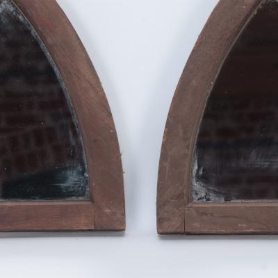 A pair of arched transome windows with later mirrors C 1900