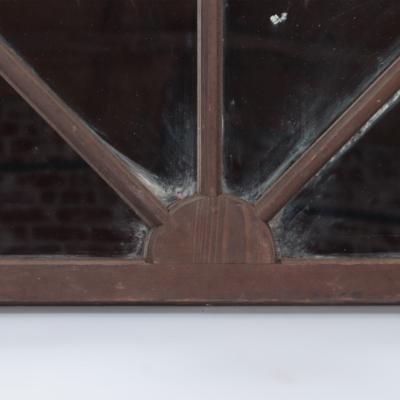 A pair of arched transome windows with later mirrors C 1900