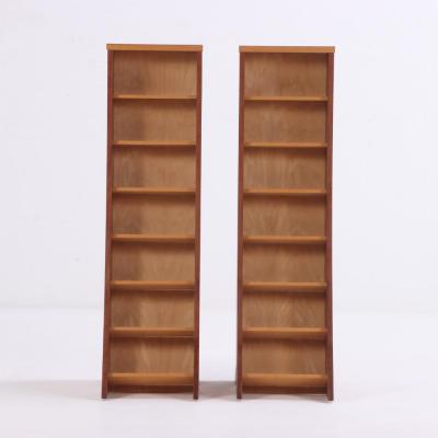 A pair of bench made sculptural walnut bookcases Contemporary