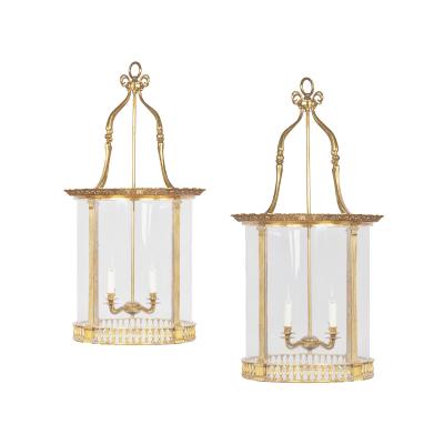 A pair of brass drum lanterns in the style of Lutyens