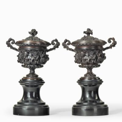 A pair of bronze vases and covers in the classical style