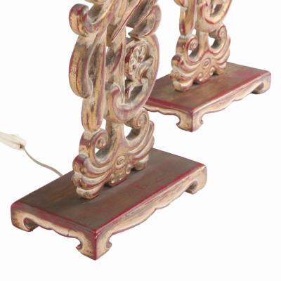 A pair of carved table lamps in the manner of James Mont C 1950 