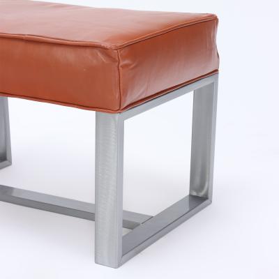 A pair of chrome and leather covered benches or small stools Contemporary