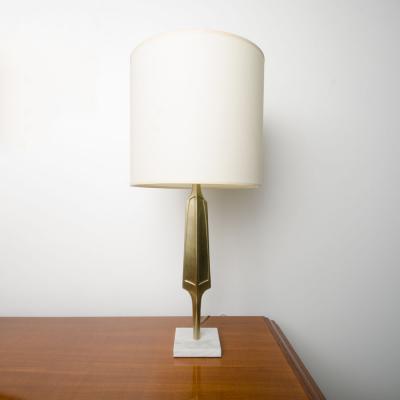 A pair of contemporary brass lamps on square marble bases