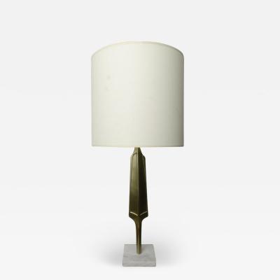 A pair of contemporary brass lamps on square marble bases