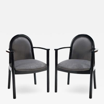 A pair of ebonized Italian armchairs circa 1980 with new fabric 