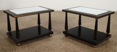 A pair of ebonized and gilt marble top end tables on ball feet circa 1950 