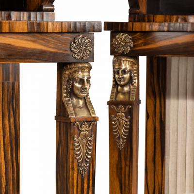 A pair of high Regency coromandel and ormolu bookcase console tables