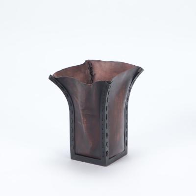 A pair of iron and leather waste baskets Contemporary