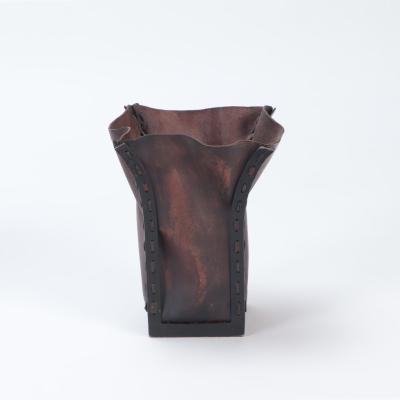 A pair of iron and leather waste baskets Contemporary