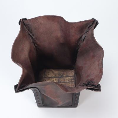 A pair of iron and leather waste baskets Contemporary