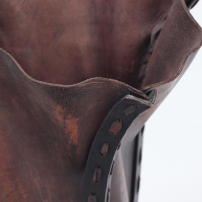 A pair of iron and leather waste baskets Contemporary