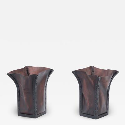 A pair of iron and leather waste baskets Contemporary