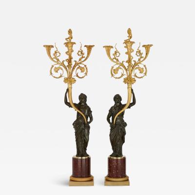 A pair of large French ormolu and patinated bronze candelabra