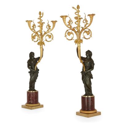 A pair of large French ormolu and patinated bronze candelabra