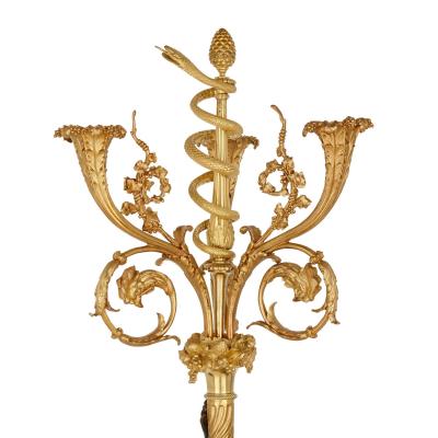 A pair of large French ormolu and patinated bronze candelabra