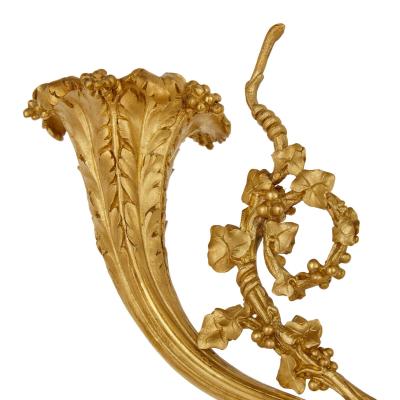 A pair of large French ormolu and patinated bronze candelabra